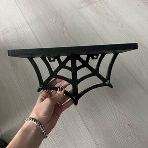 black cobweb shelf
